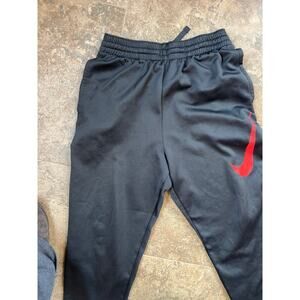 NIKE DRI-FIT, YOUTH XL size 16 black with red swoosh, joggers